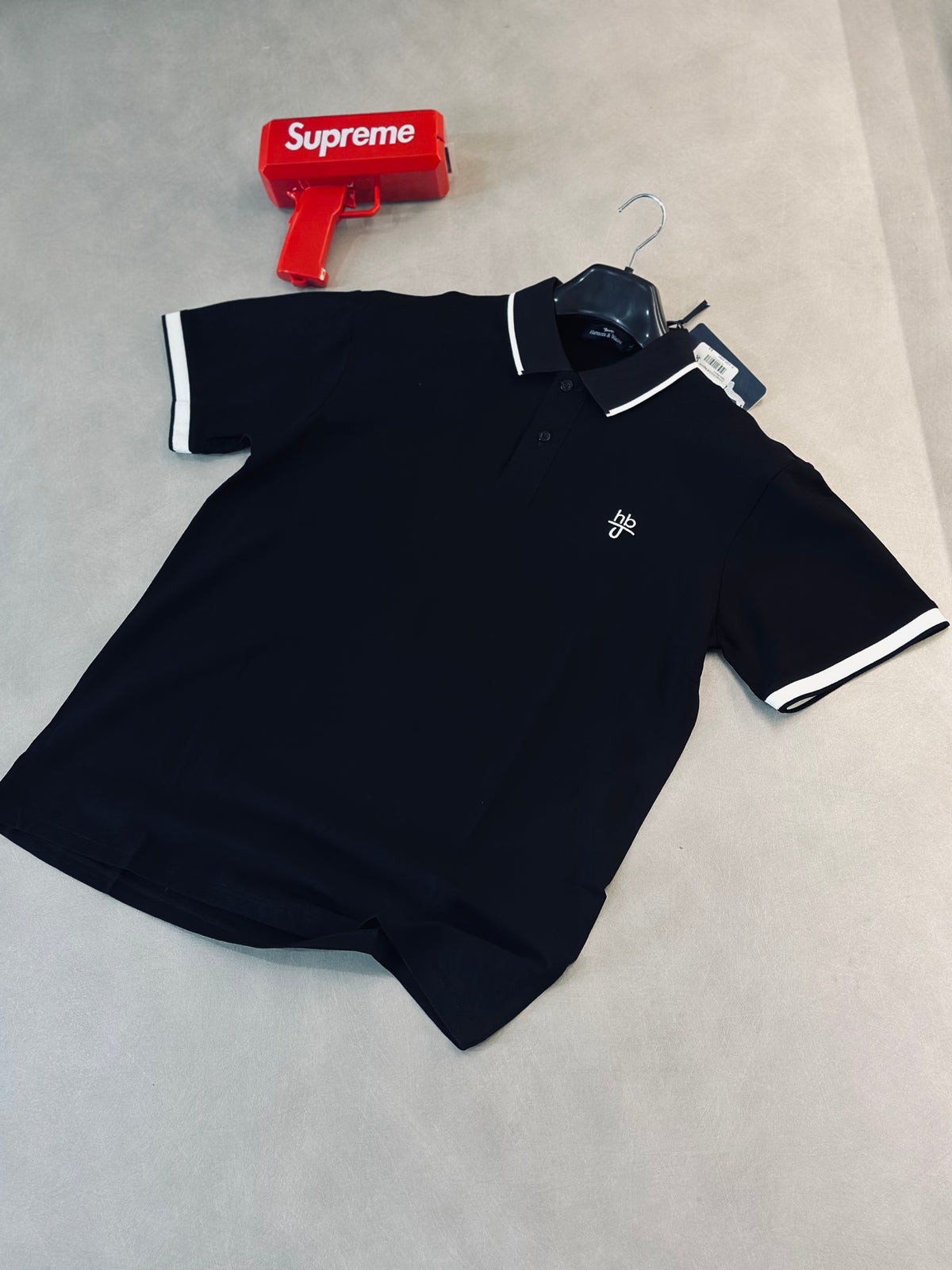 CAMISETA POLO HAR NEGRA HB TEJIDO BLANCO