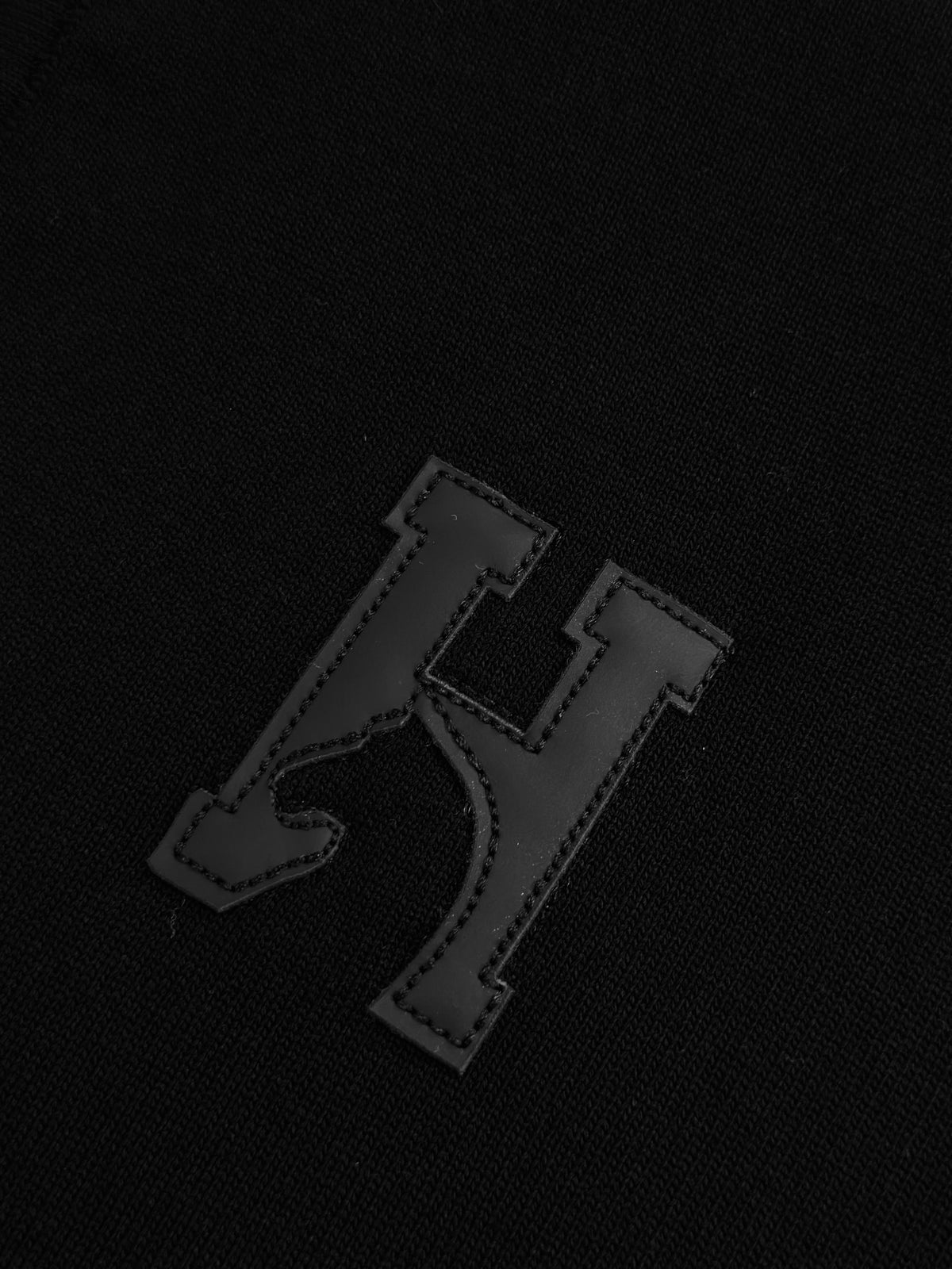 CAMISETA POLO HER NEGRA TEJIDO H CUERINA