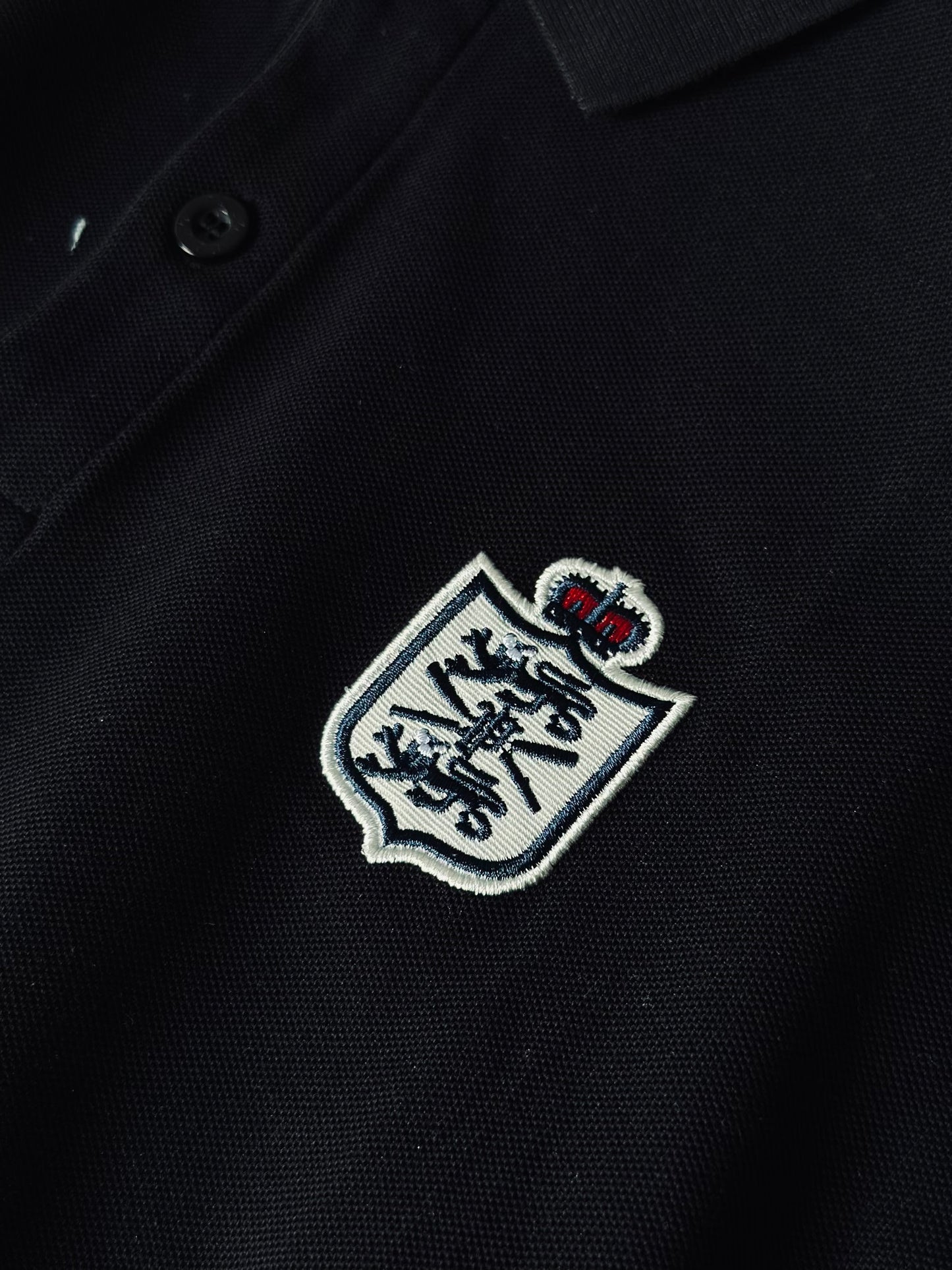 CAMISETA POLO RAL NEGRA ESCUDO